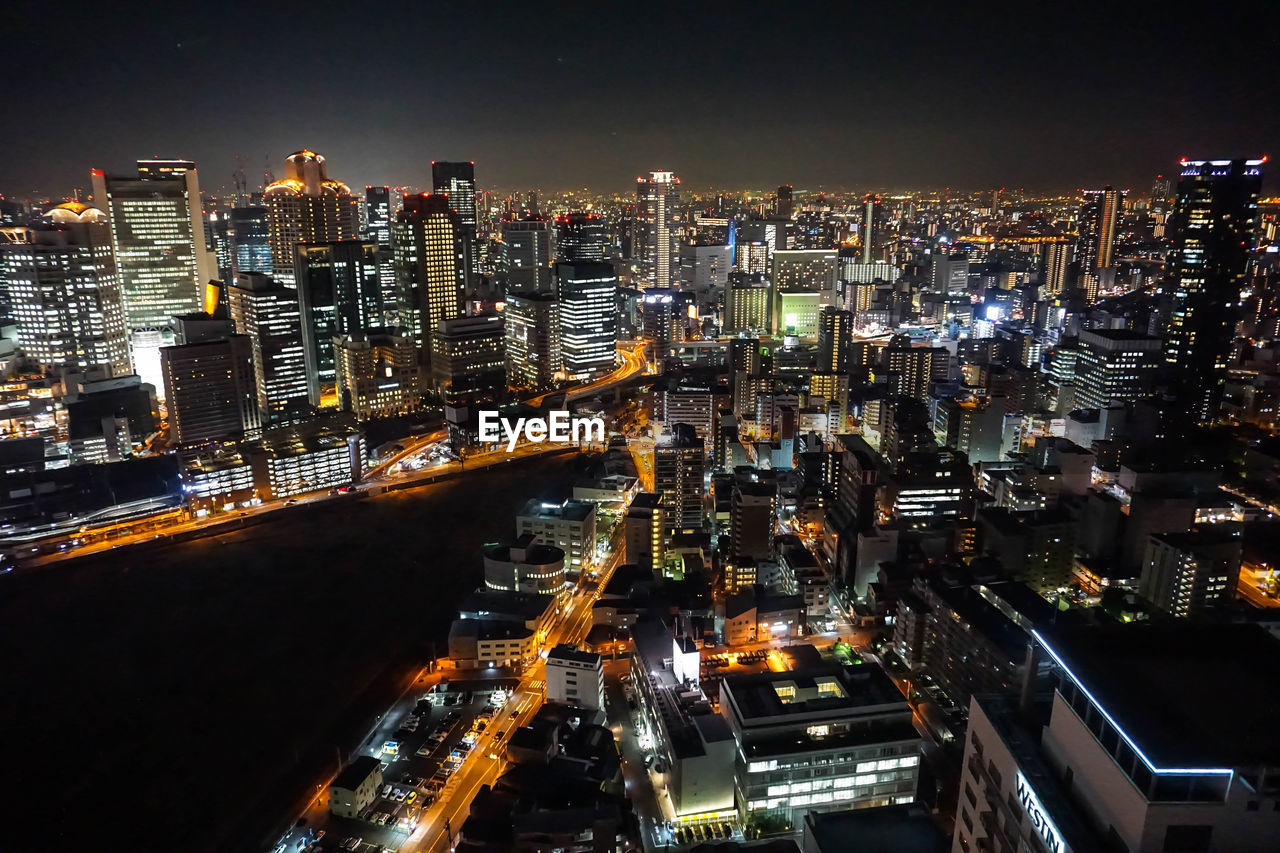 Aerial view of illuminated city at night