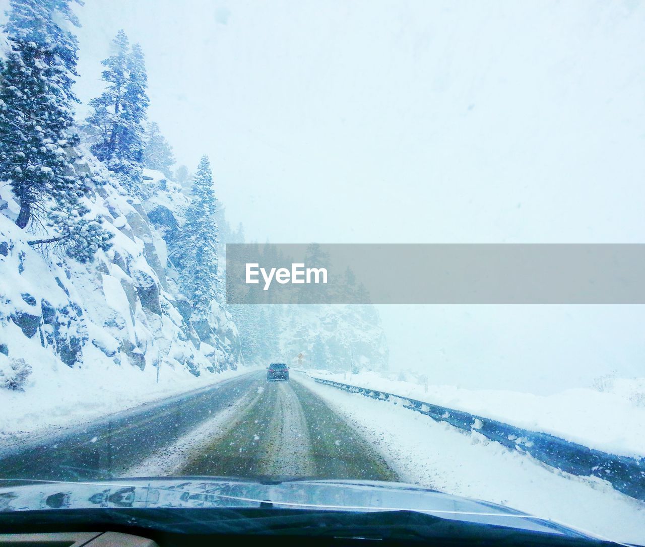 CAR ON ROAD IN WINTER