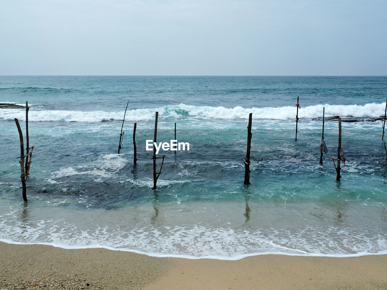 Scenic view of beach and sea against sky