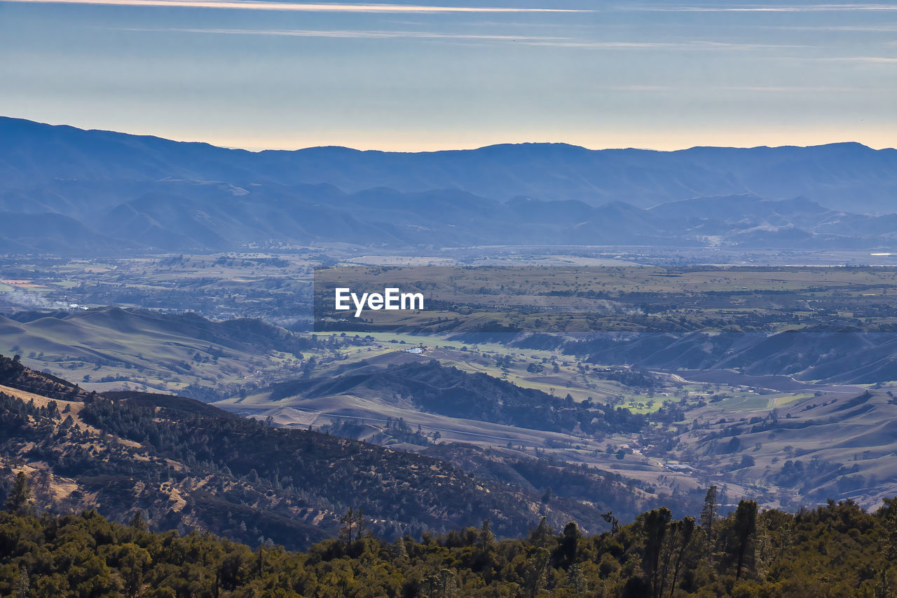 AERIAL VIEW OF LANDSCAPE AND MOUNTAINS