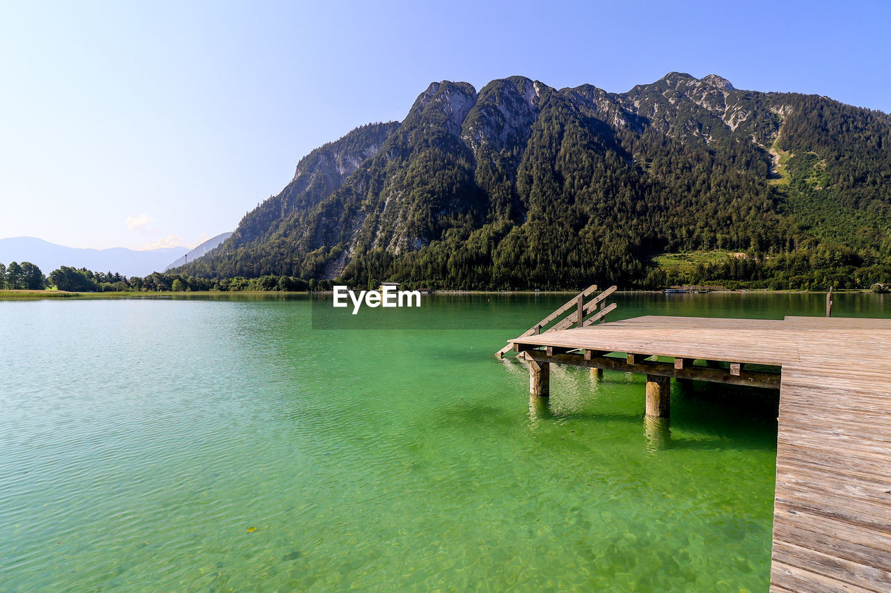 Bathing area with wooden construction at picturesque alpine achen lake near maurach.