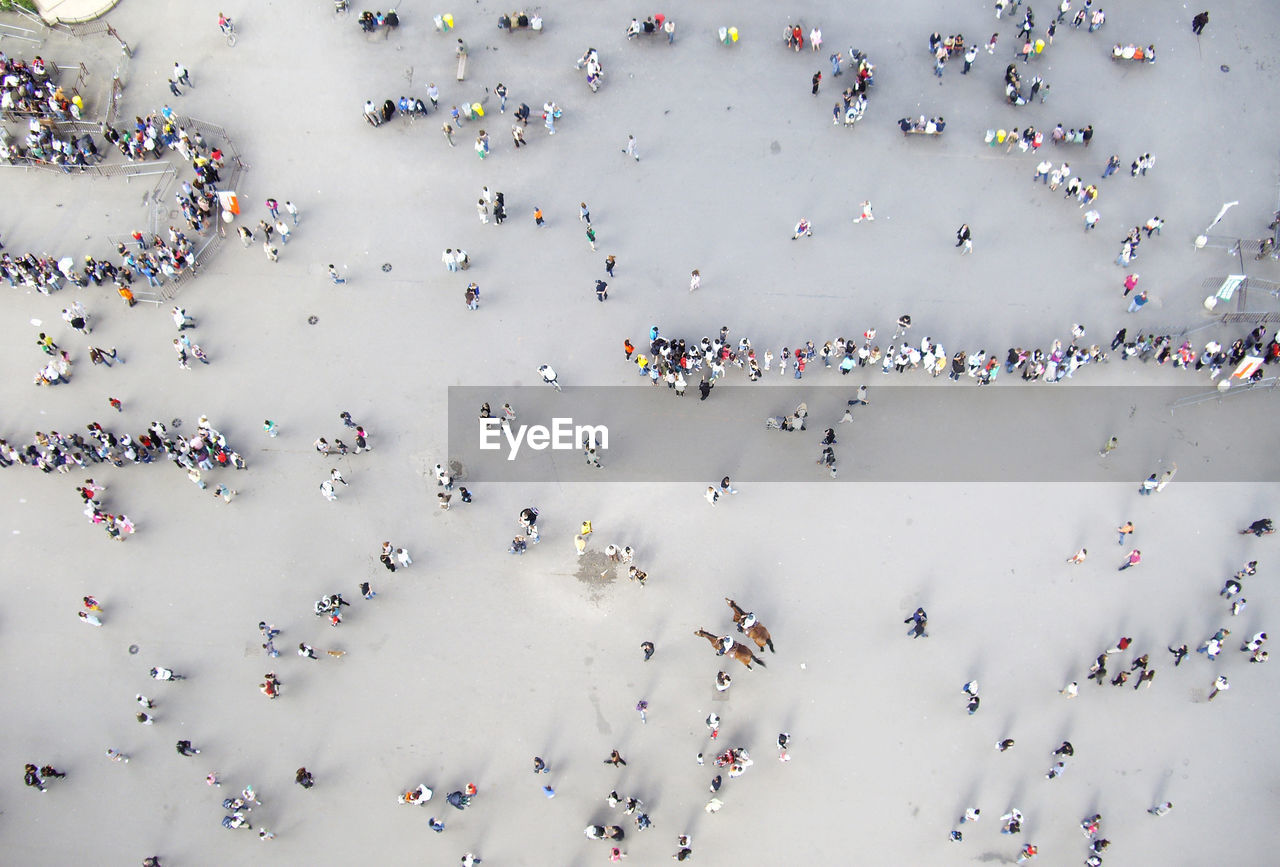 HIGH ANGLE VIEW OF CROWD IN PEOPLE