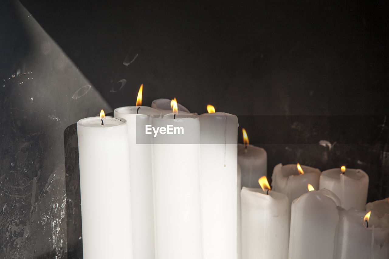 Close-up of burning candles at tapsa temple