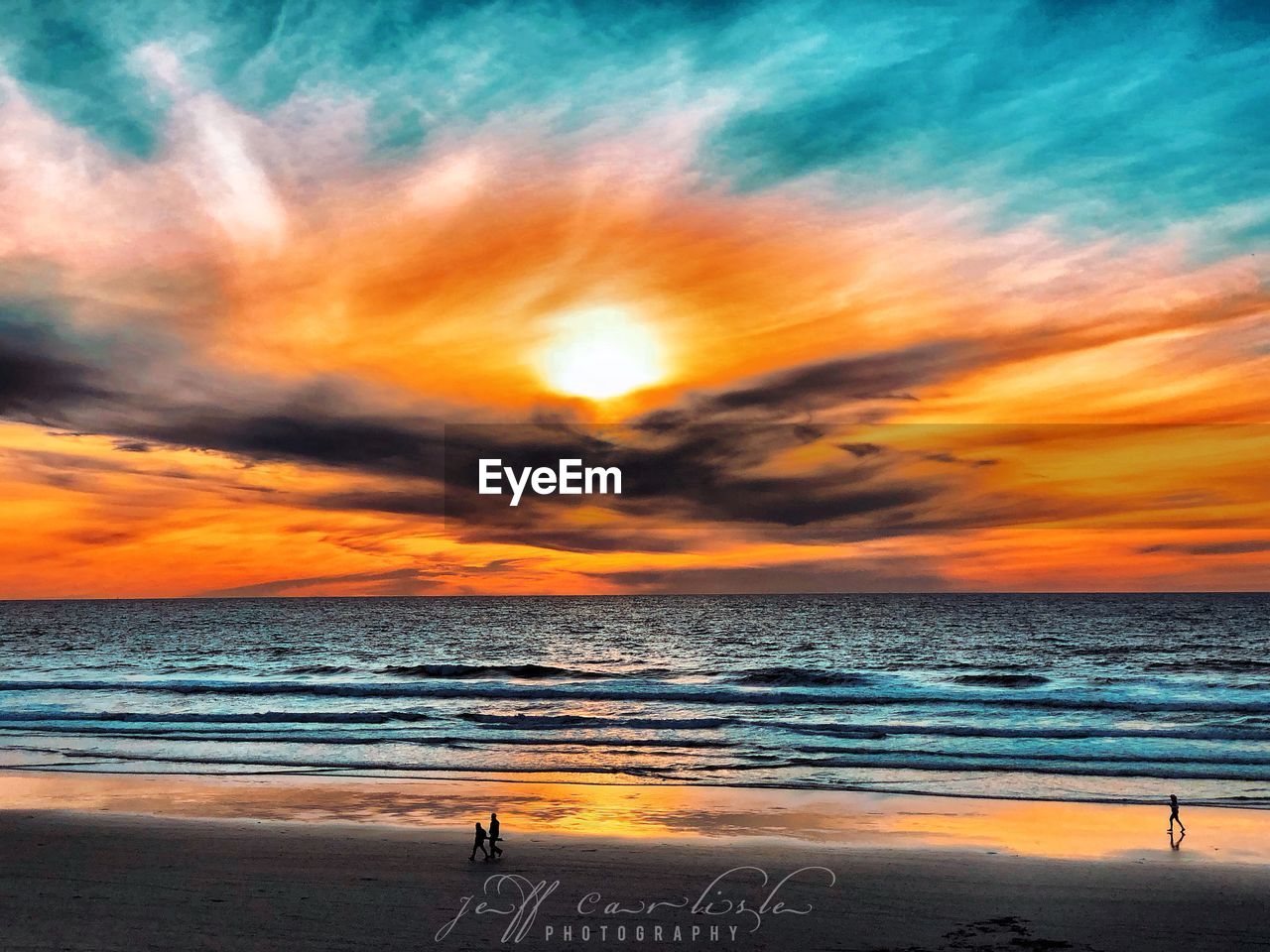 SCENIC VIEW OF BEACH DURING SUNSET