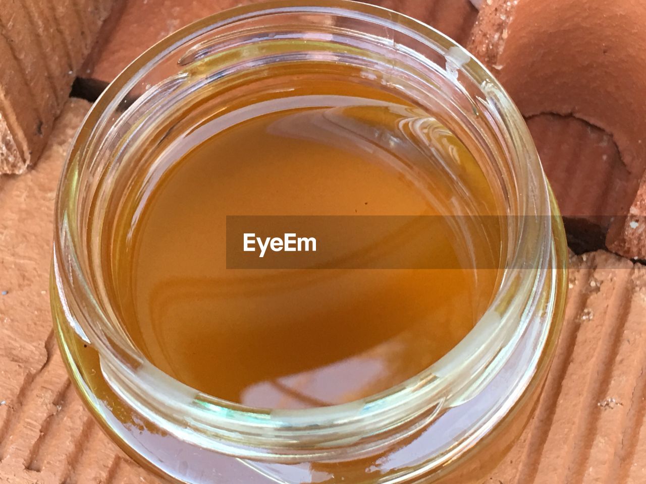 CLOSE-UP OF TEA IN GLASS JAR ON TABLE