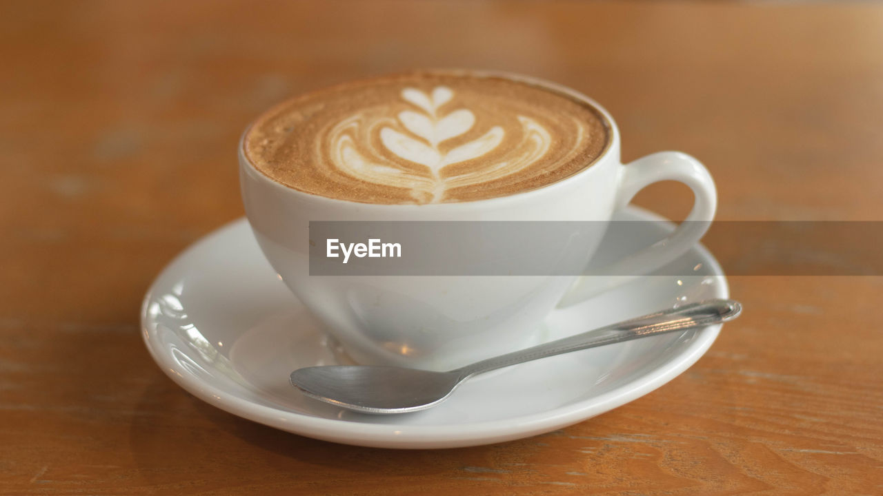 Close-up of cappuccino on table