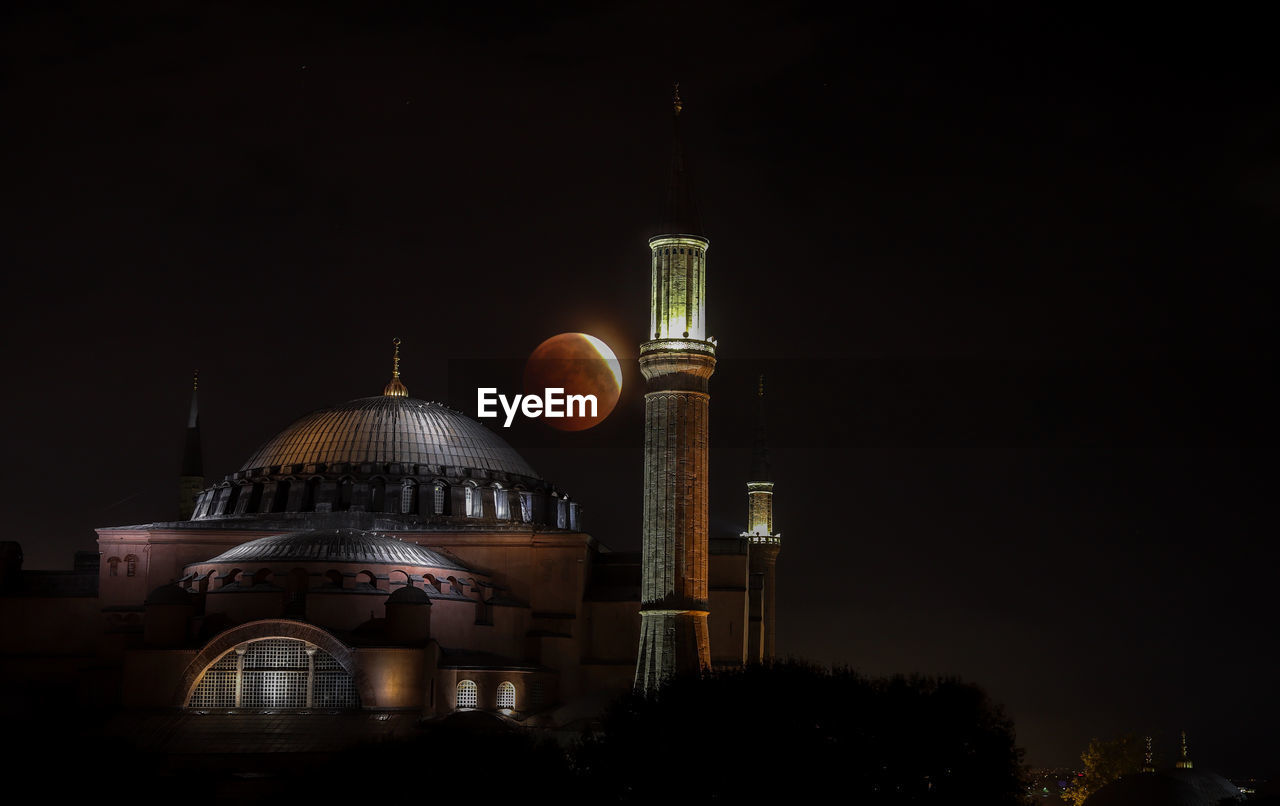 ILLUMINATED BUILDING AT NIGHT