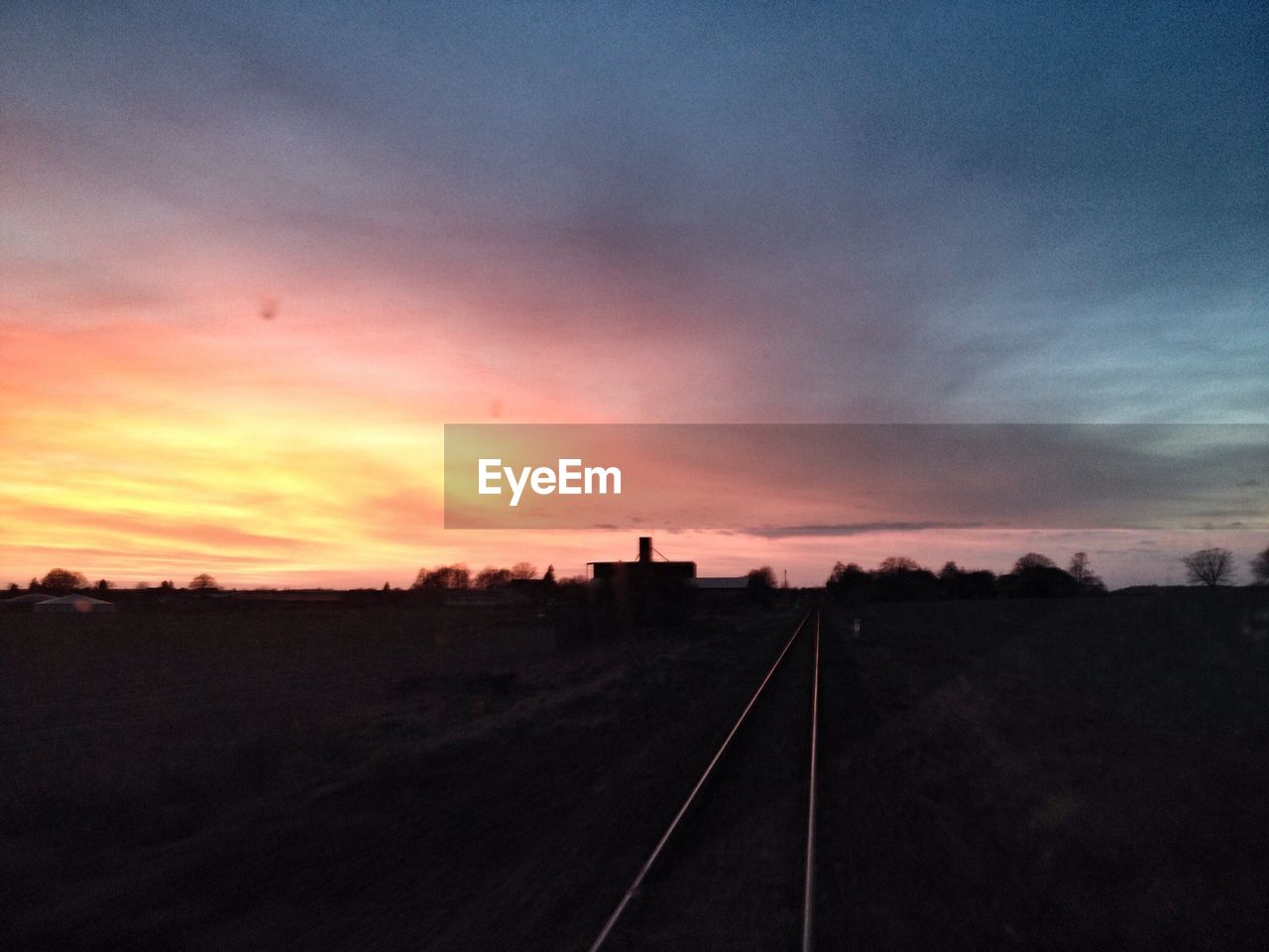 Railroad track with sky in background