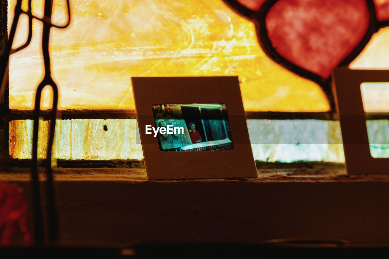 CLOSE-UP OF TELEPHONE ON TABLE