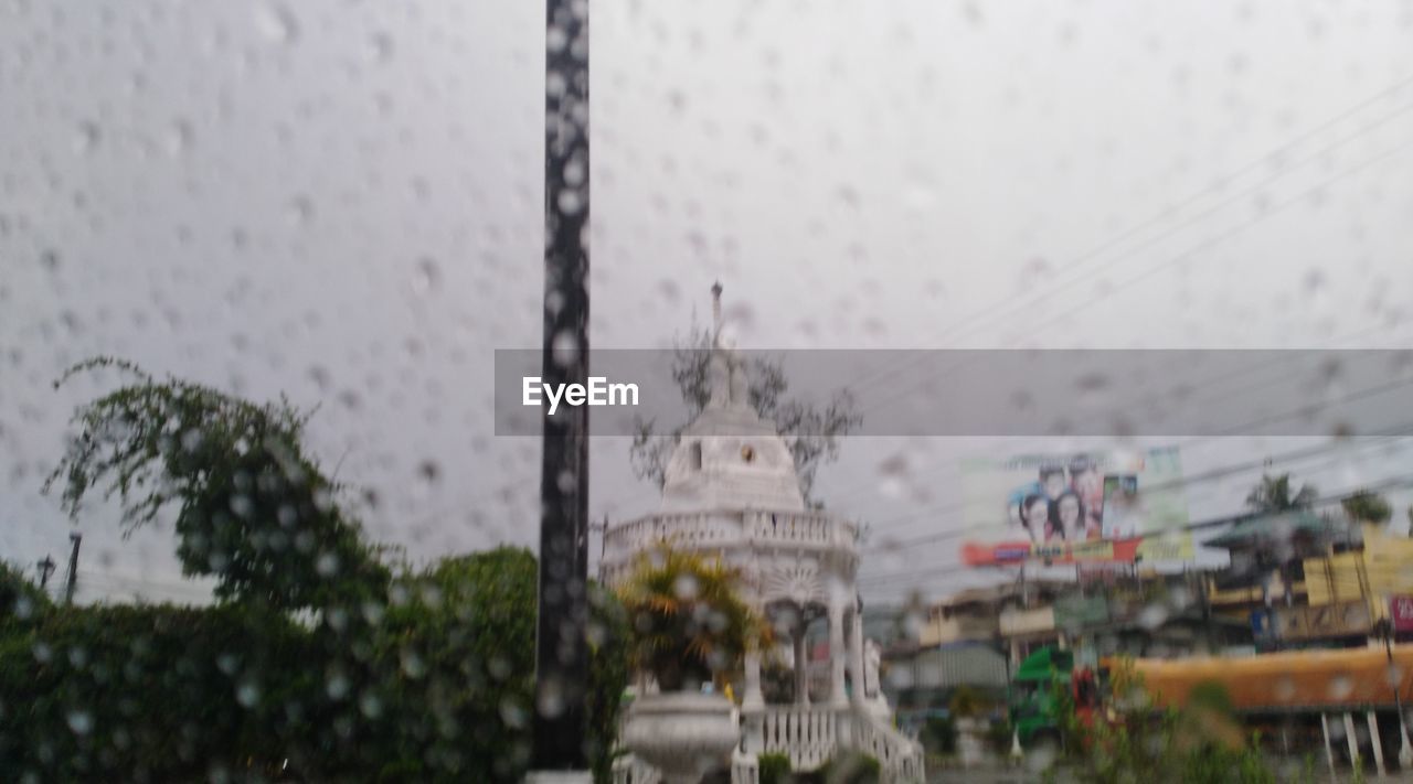 BUILDINGS SEEN THROUGH WET WINDOW