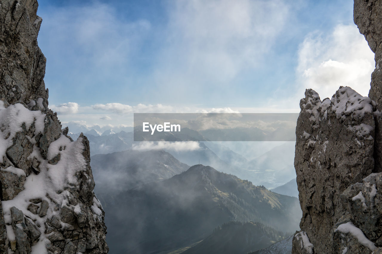 Scenic view of snowcapped mountains against sky