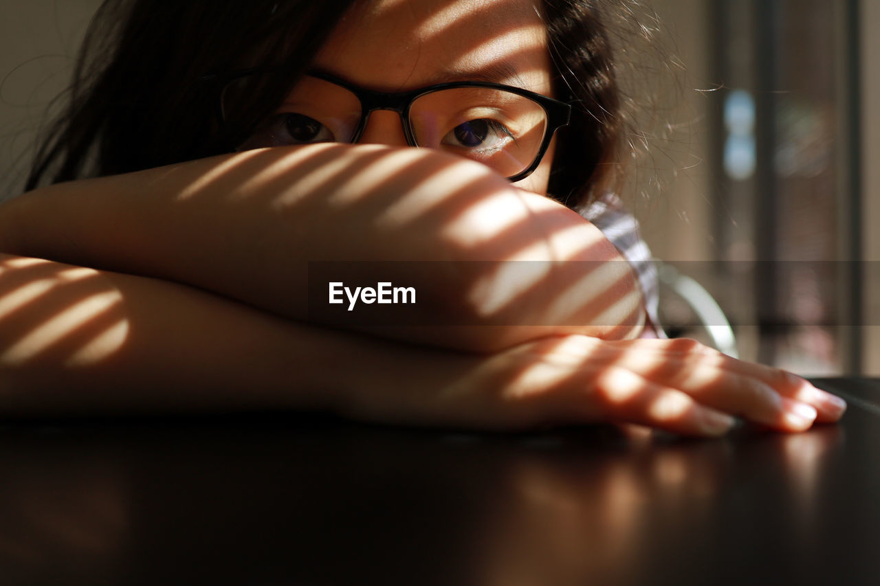 Close-up portrait of girl wearing eyeglasses