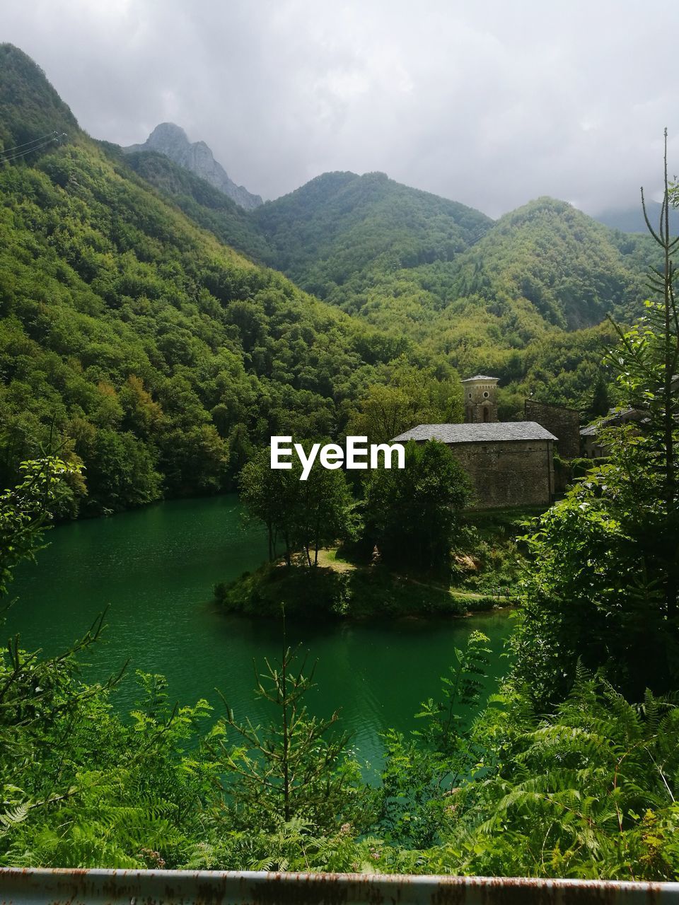 SCENIC VIEW OF LAKE AND MOUNTAINS