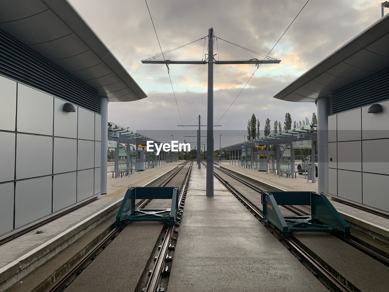 Tram station platform against sky