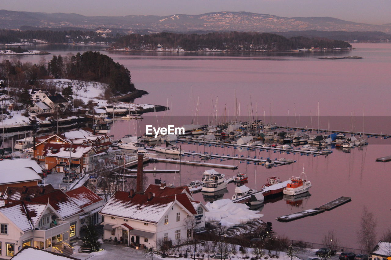 High angle view of lake and buildings in town