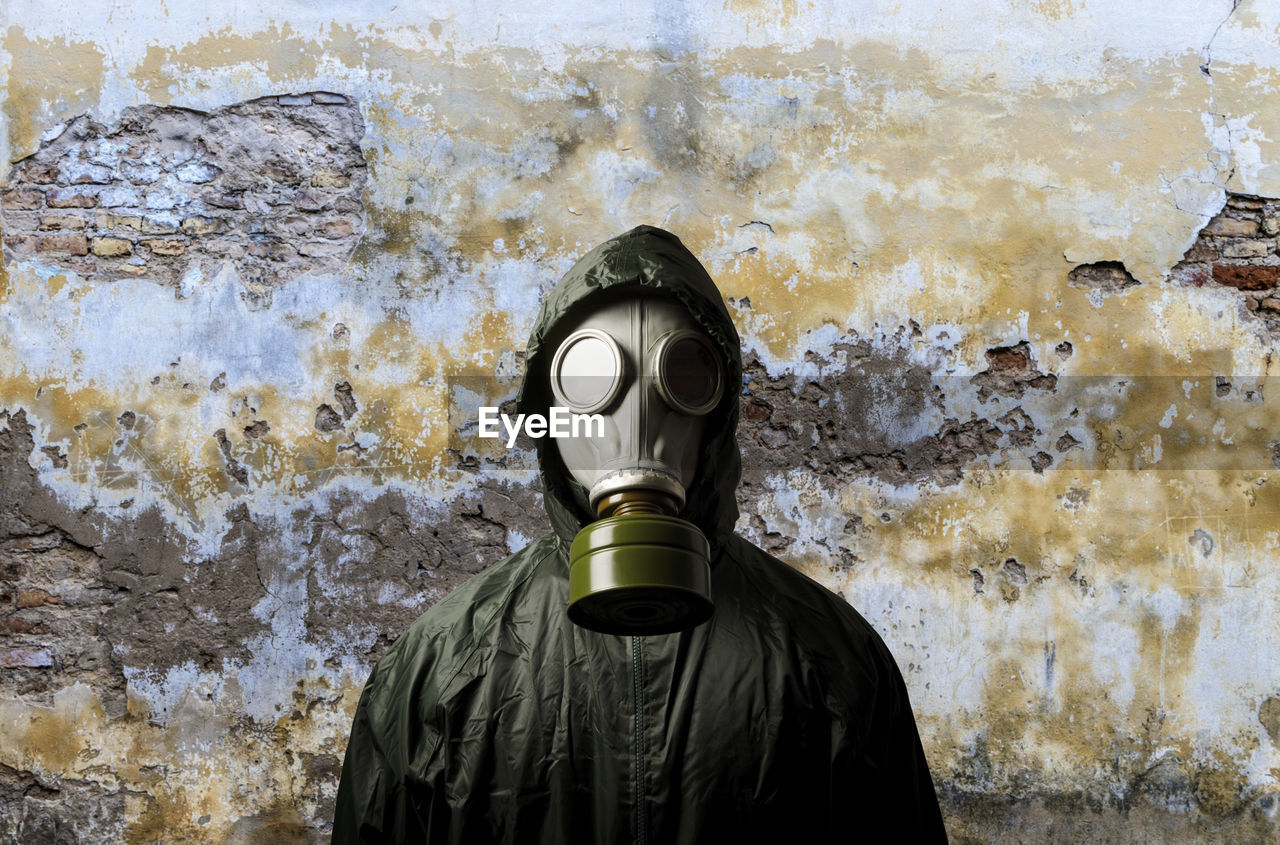 gas mask, mask, art, clothing, one person, men, protective mask - workwear, obscured face, protection, security, personal protective equipment, costume, wall - building feature, disguise, waist up, day, standing, pollution, outdoors, mask - disguise