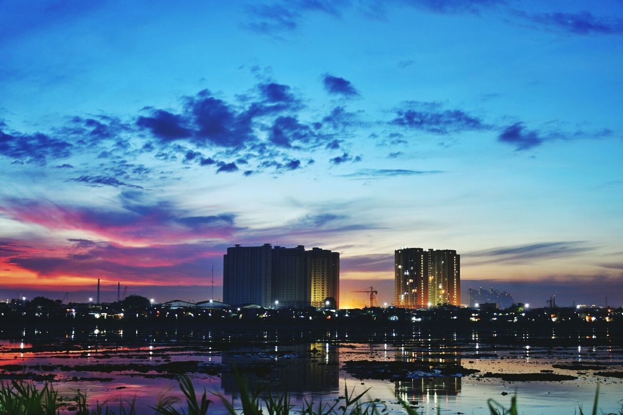 VIEW OF CITY AT SUNSET