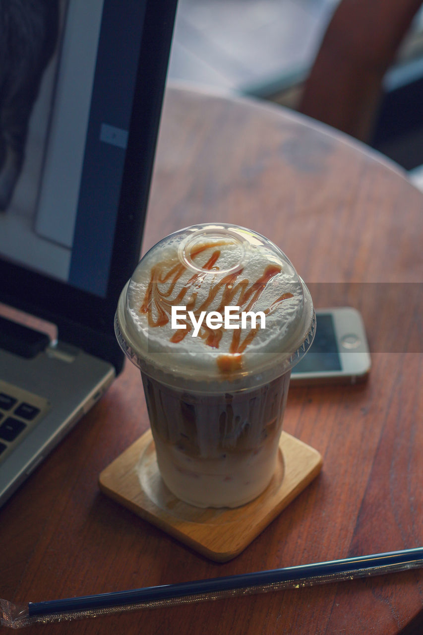 High angle view of coffee cup on table