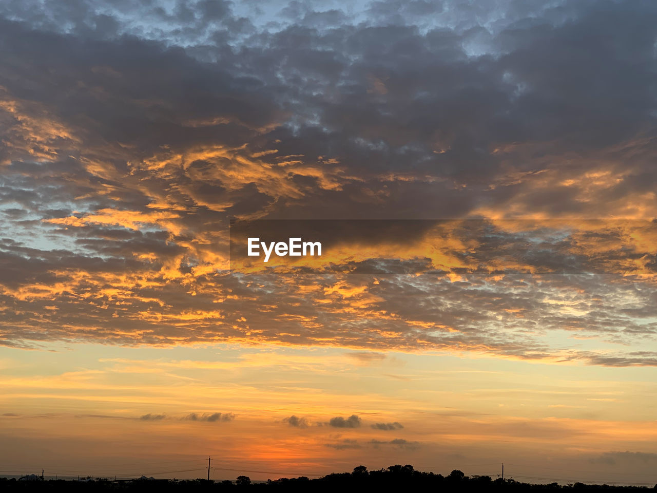 Low angle view of dramatic sky during sunset