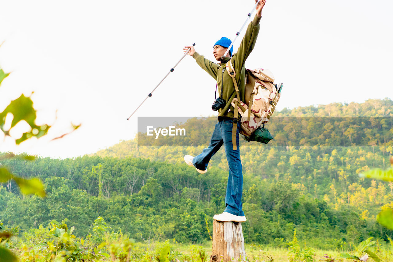 Low angle view of man standing on field