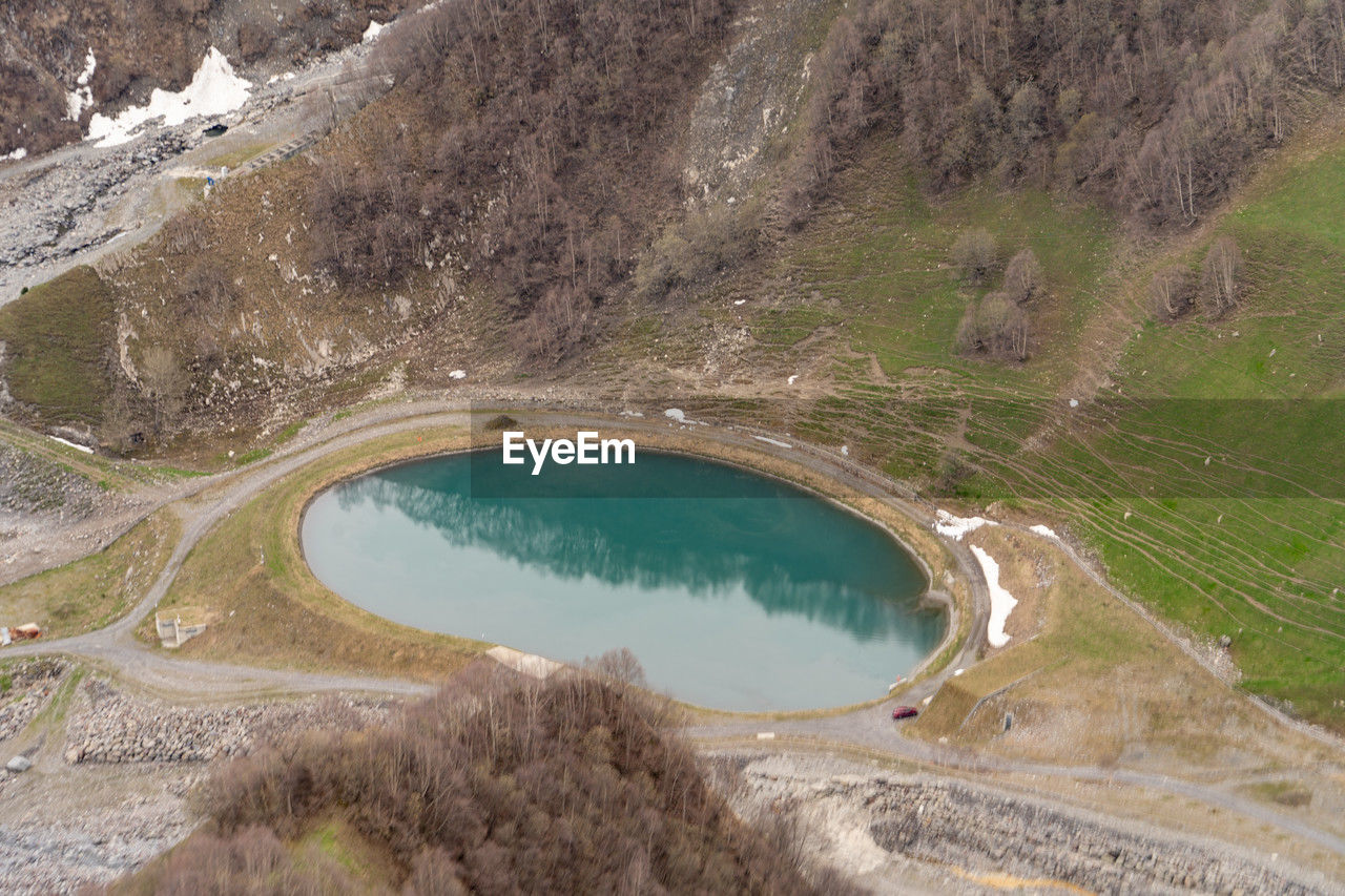 reservoir, water, environment, aerial photography, landscape, scenics - nature, nature, volcanic crater, beauty in nature, no people, mountain, tranquility, land, infrastructure, non-urban scene, day, high angle view, lake, aerial view, mountain pass, geology, travel destinations, travel, outdoors, tranquil scene, crater lake, tourism, physical geography, plant