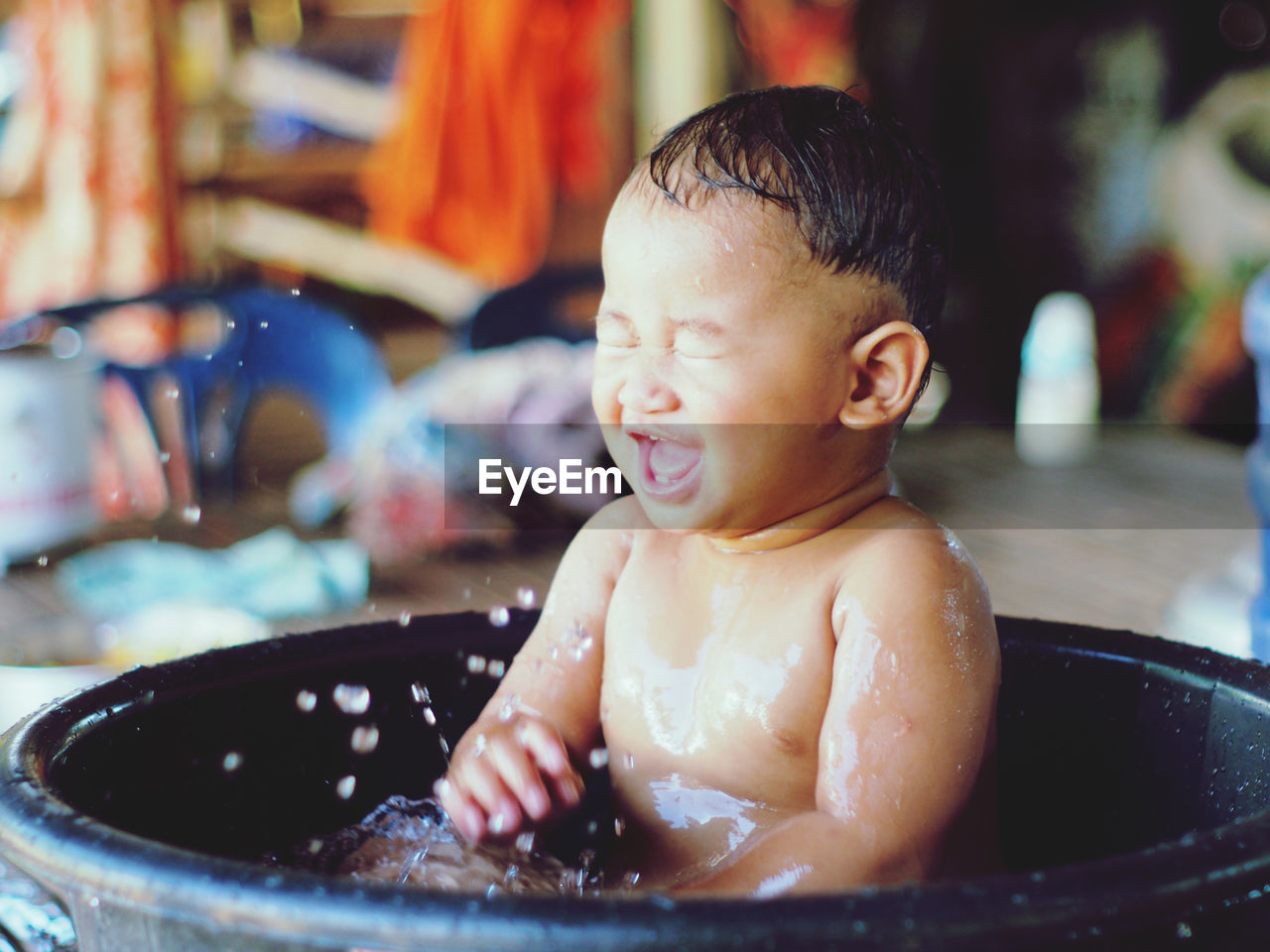 close-up of cute baby boy in sink