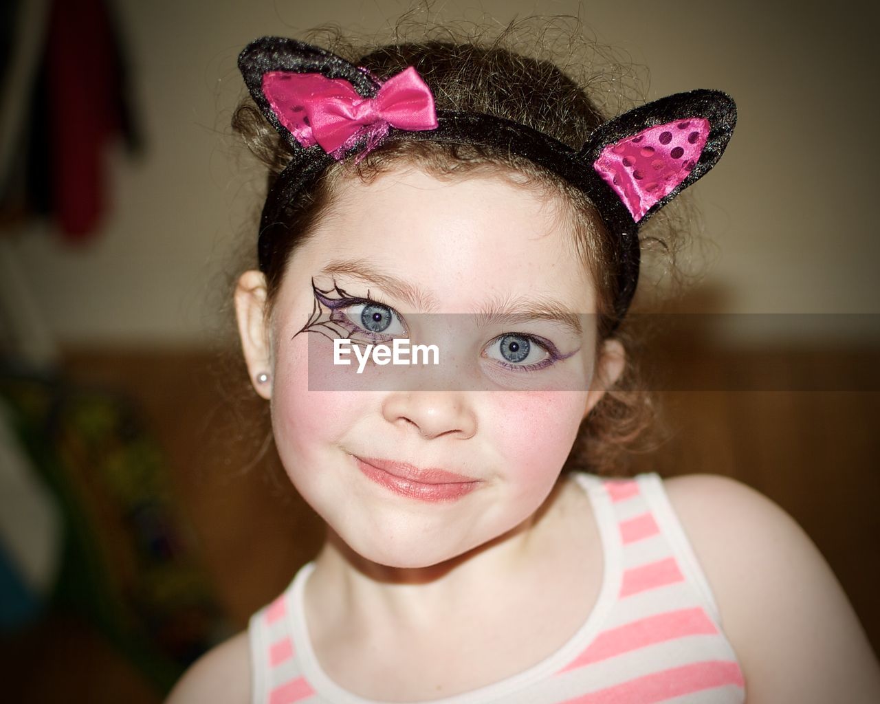 Portrait of smiling girl with eye make-up