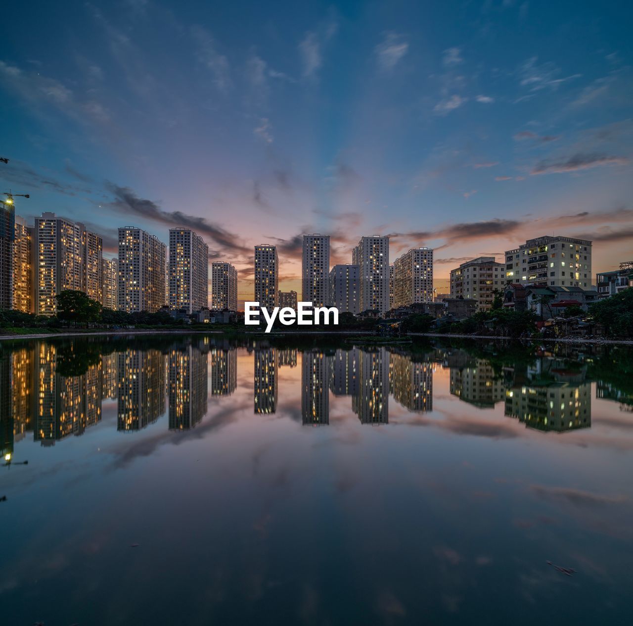 Reflection of buildings in city at night