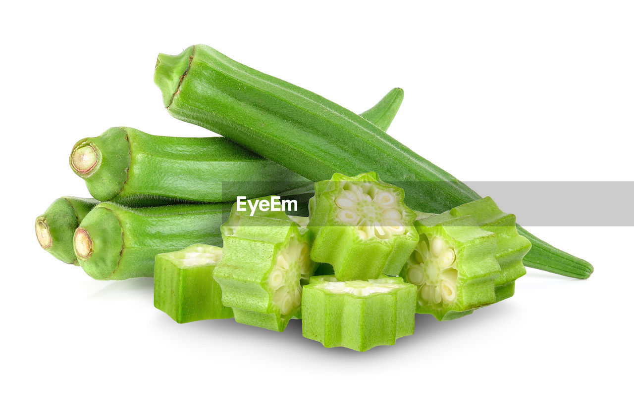 HIGH ANGLE VIEW OF CHOPPED VEGETABLES ON WHITE BACKGROUND