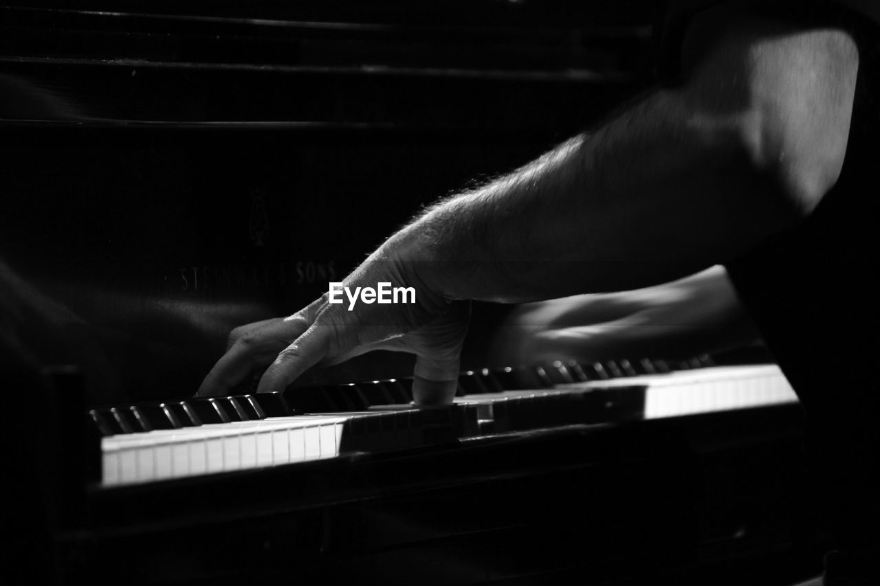 Cropped image of pianist playing piano