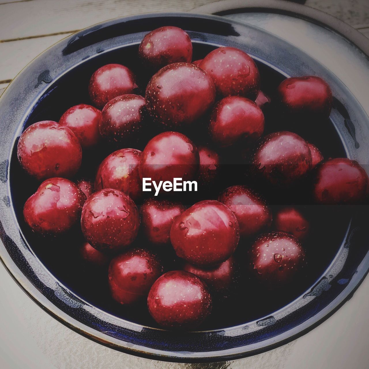 Close-up of plums in bowl