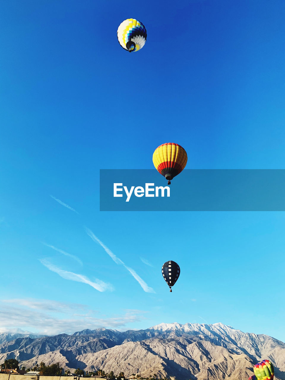 LOW ANGLE VIEW OF HOT AIR BALLOONS IN SKY