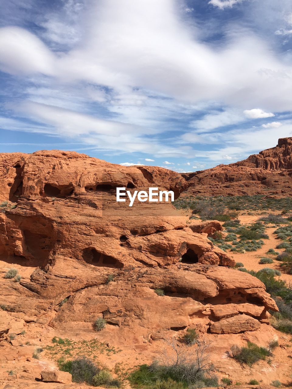 Rock formations on landscape against sky