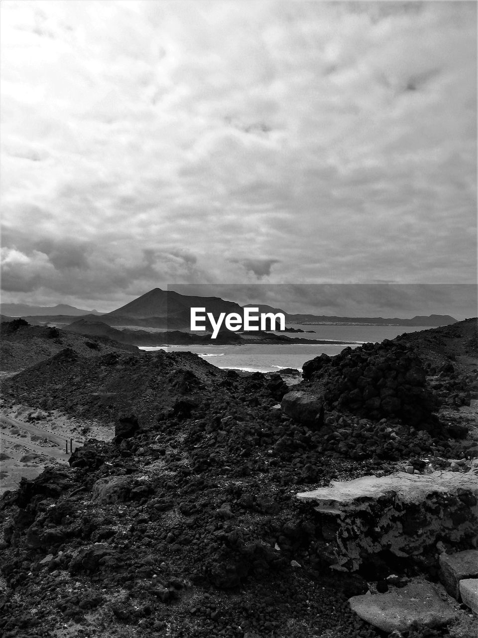 VIEW OF SEA AGAINST CLOUDY SKY