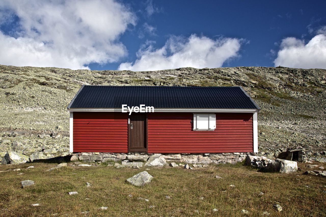 View of built structure on landscape against sky