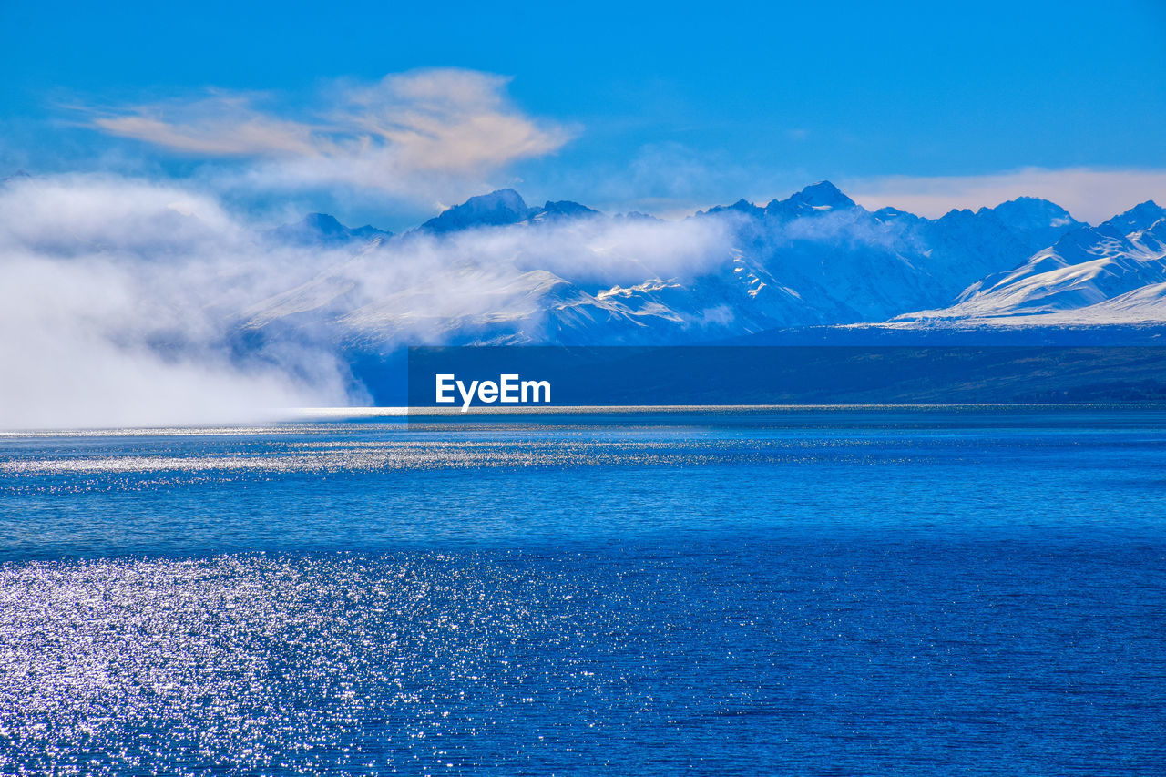 Scenic view of sea against blue sky