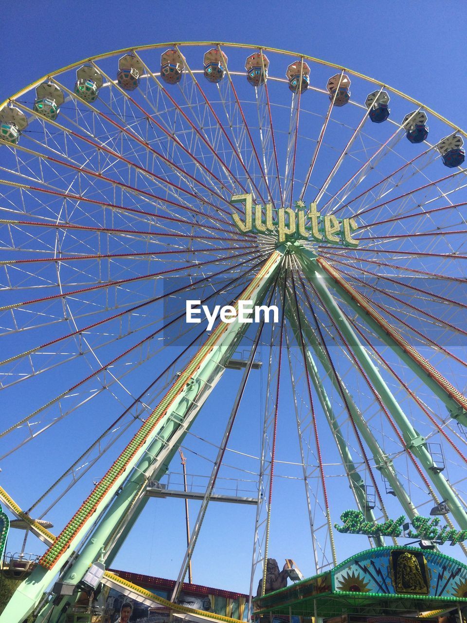 LOW ANGLE VIEW OF FERRIS WHEEL AGAINST CLEAR SKY