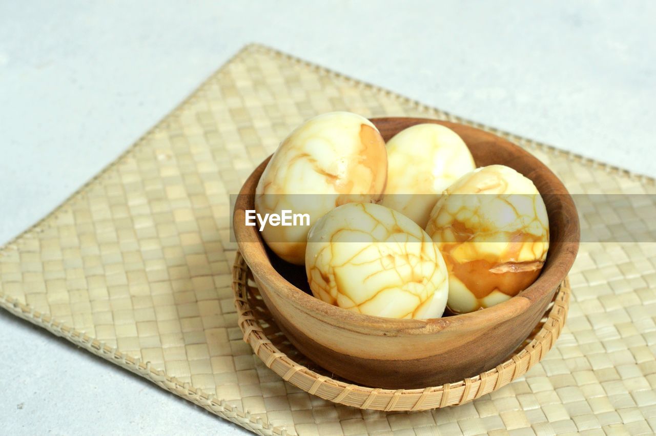 High angle view of telur pindang retak in bowl on table