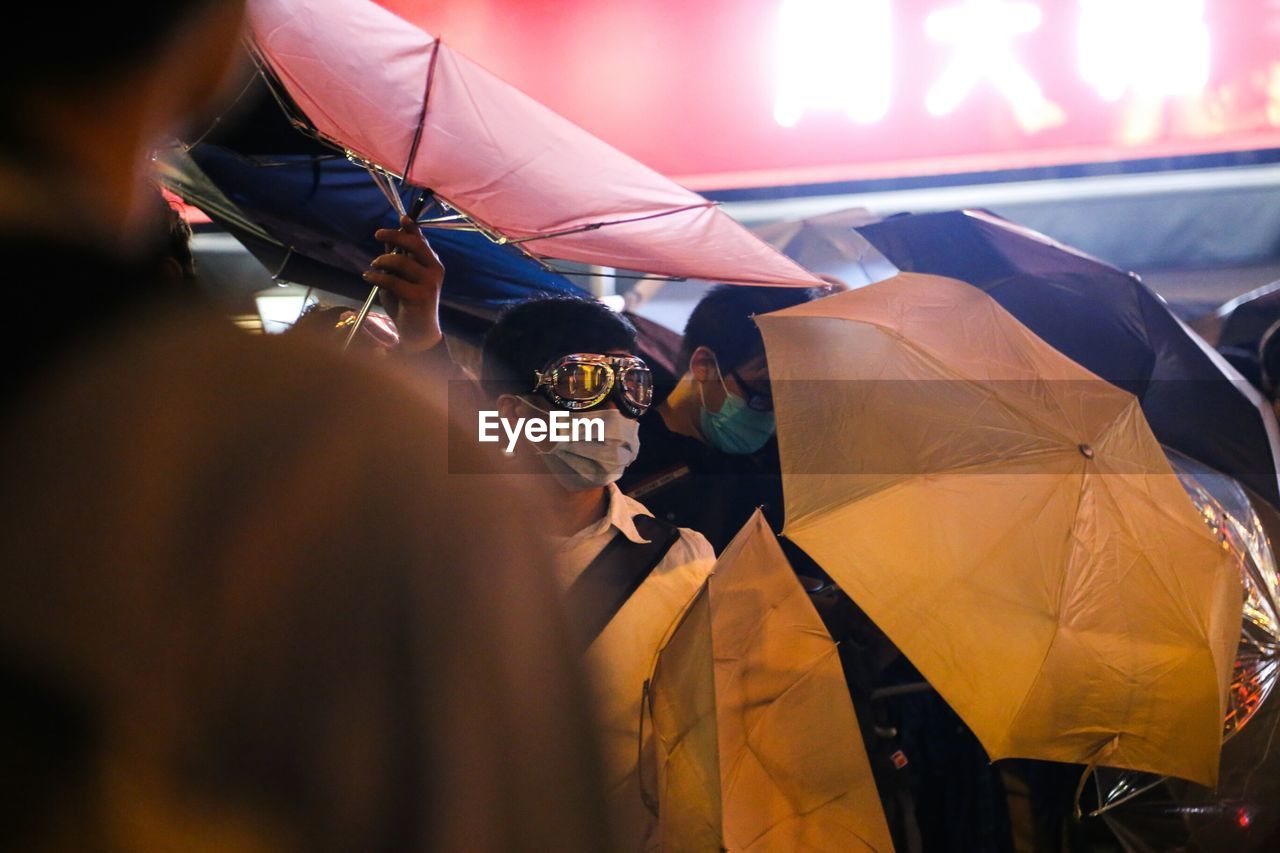 View of people with umbrellas