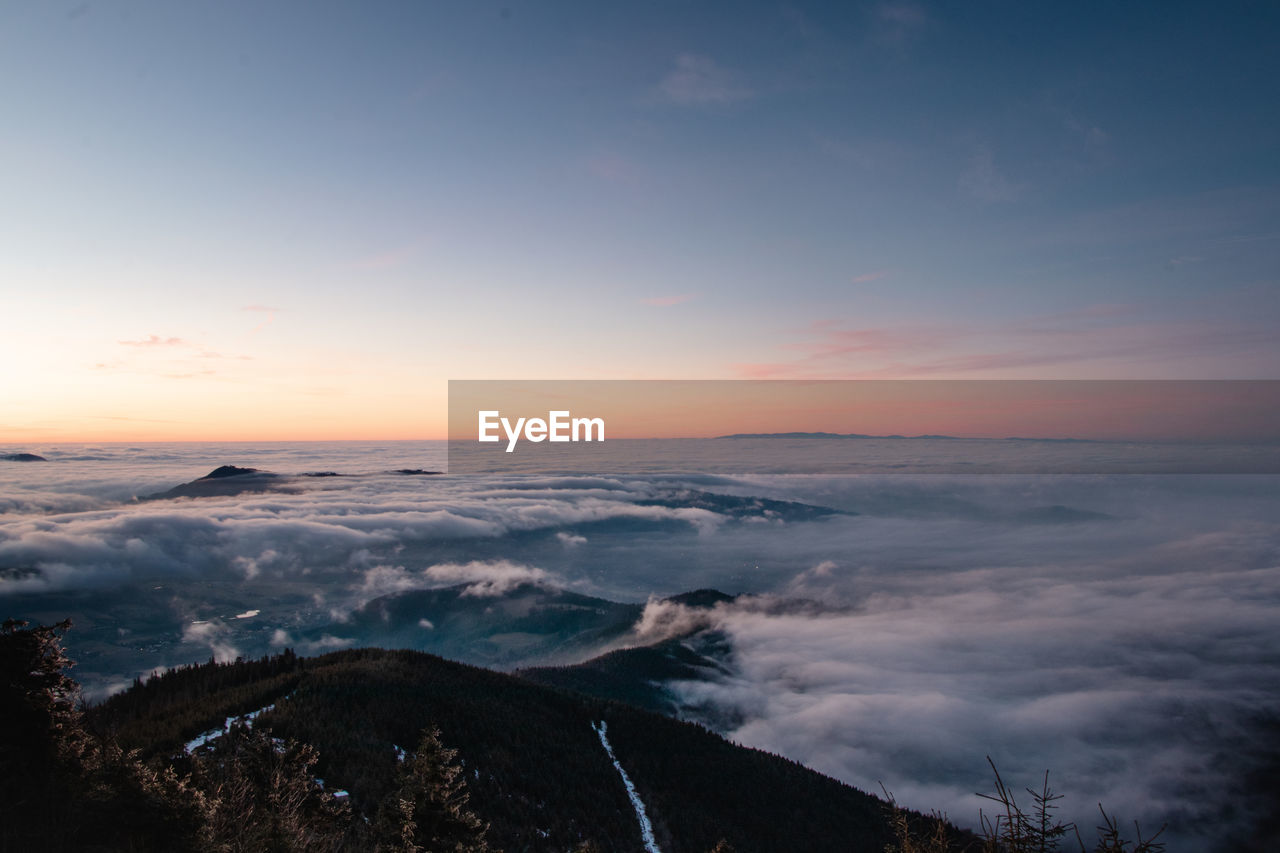 SCENIC VIEW OF LANDSCAPE AGAINST SKY DURING SUNSET