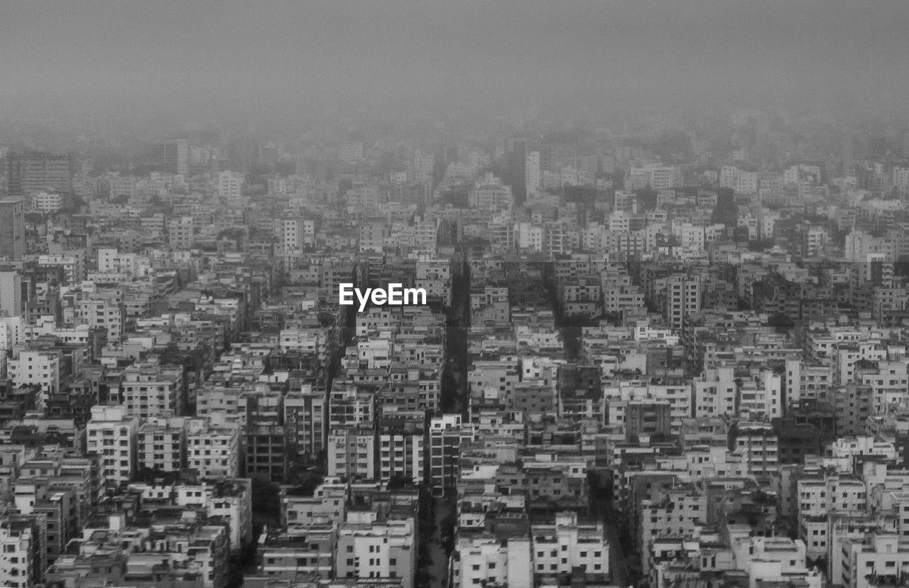 High angle view of buildings in city against sky