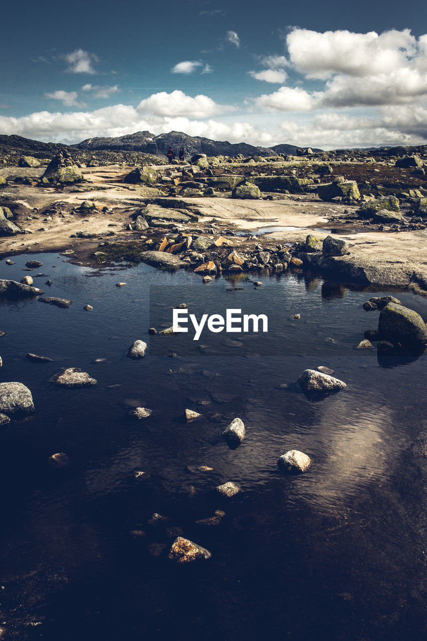 Aerial view of land and sea against sky