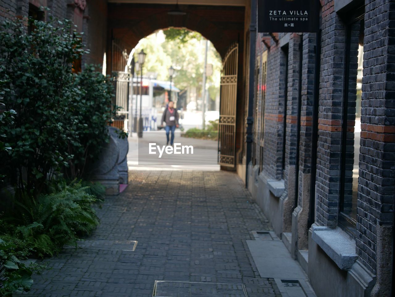 MAN WALKING IN CORRIDOR