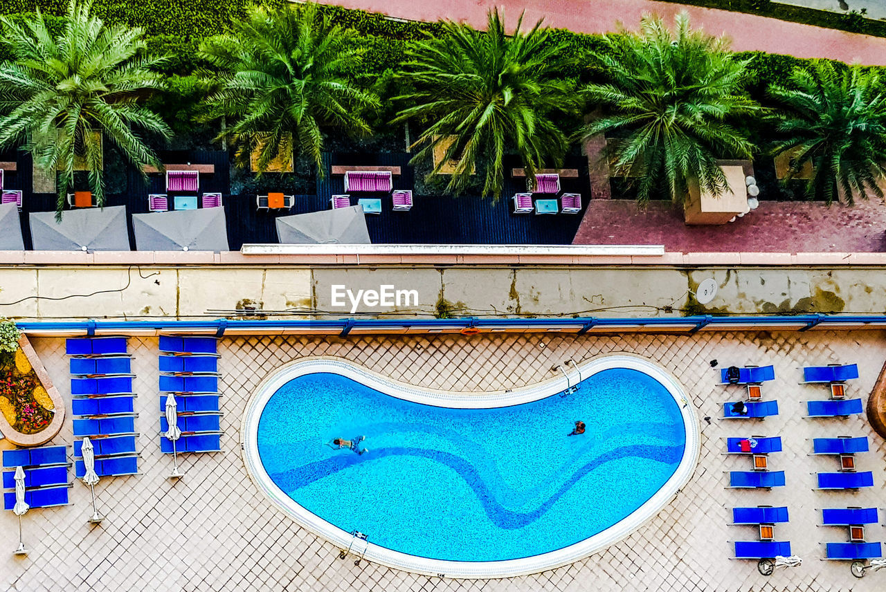 VIEW OF SWIMMING POOL AGAINST BLUE SKY