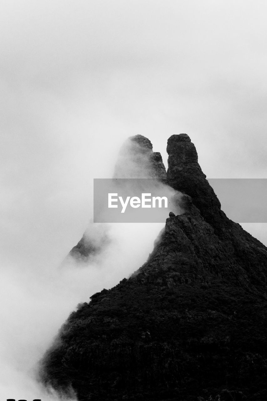 mountain, sky, black and white, cloud, monochrome, rock, monochrome photography, nature, beauty in nature, scenics - nature, fog, environment, landscape, no people, geology, land, travel destinations, outdoors, volcano, non-urban scene, mountain peak, day, travel, rock formation, black, summit, snow, physical geography
