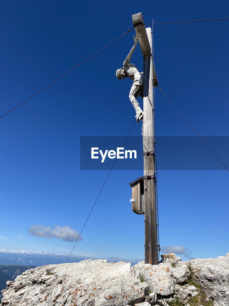 LOW ANGLE VIEW OF POWER LINES AGAINST CLEAR BLUE SKY