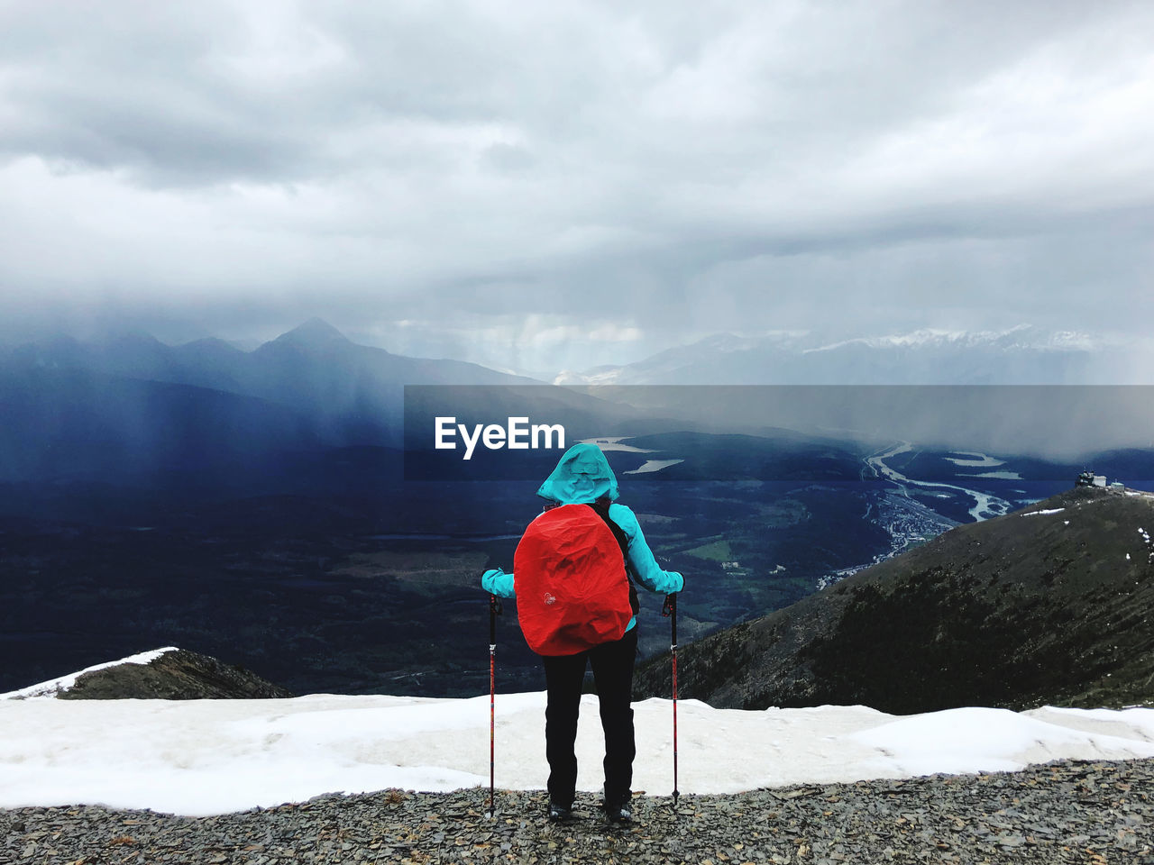 Rear view of person standing on mountain