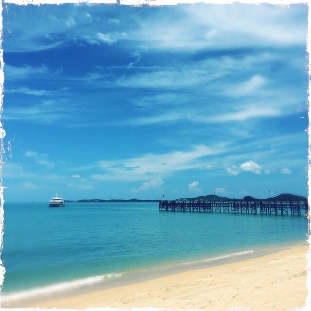 water, sea, land, sky, beach, scenics - nature, nature, cloud, beauty in nature, travel destinations, tranquil scene, tranquility, blue, sand, travel, vacation, trip, no people, holiday, day, outdoors, tourism, horizon, coastline, ocean, idyllic, nautical vessel, architecture, horizon over water, coast, summer, shore, environment, tropical climate, body of water, landscape, azure, sunlight, auto post production filter, transportation, transfer print