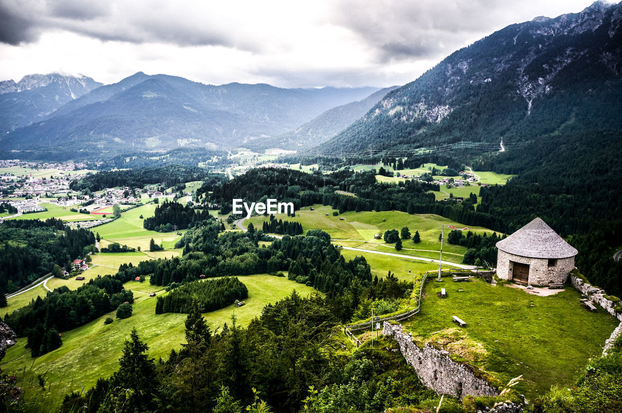 Scenic view of landscape and mountains against sky