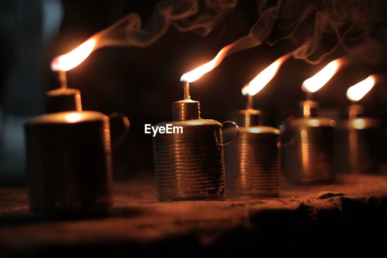 Illuminated oil lamps at night